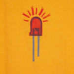 close up of the front of an orange t-shirt on hanger hanging on a nail against a white wall. It is hand printed with an LED design